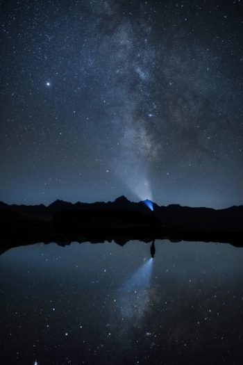 silhouette of mountain during night time